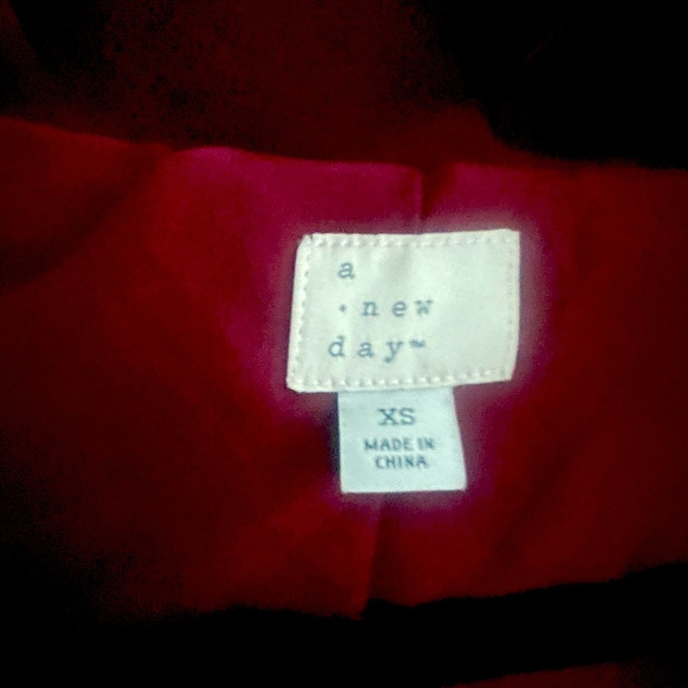 Maroon fur coat. Never been worn.